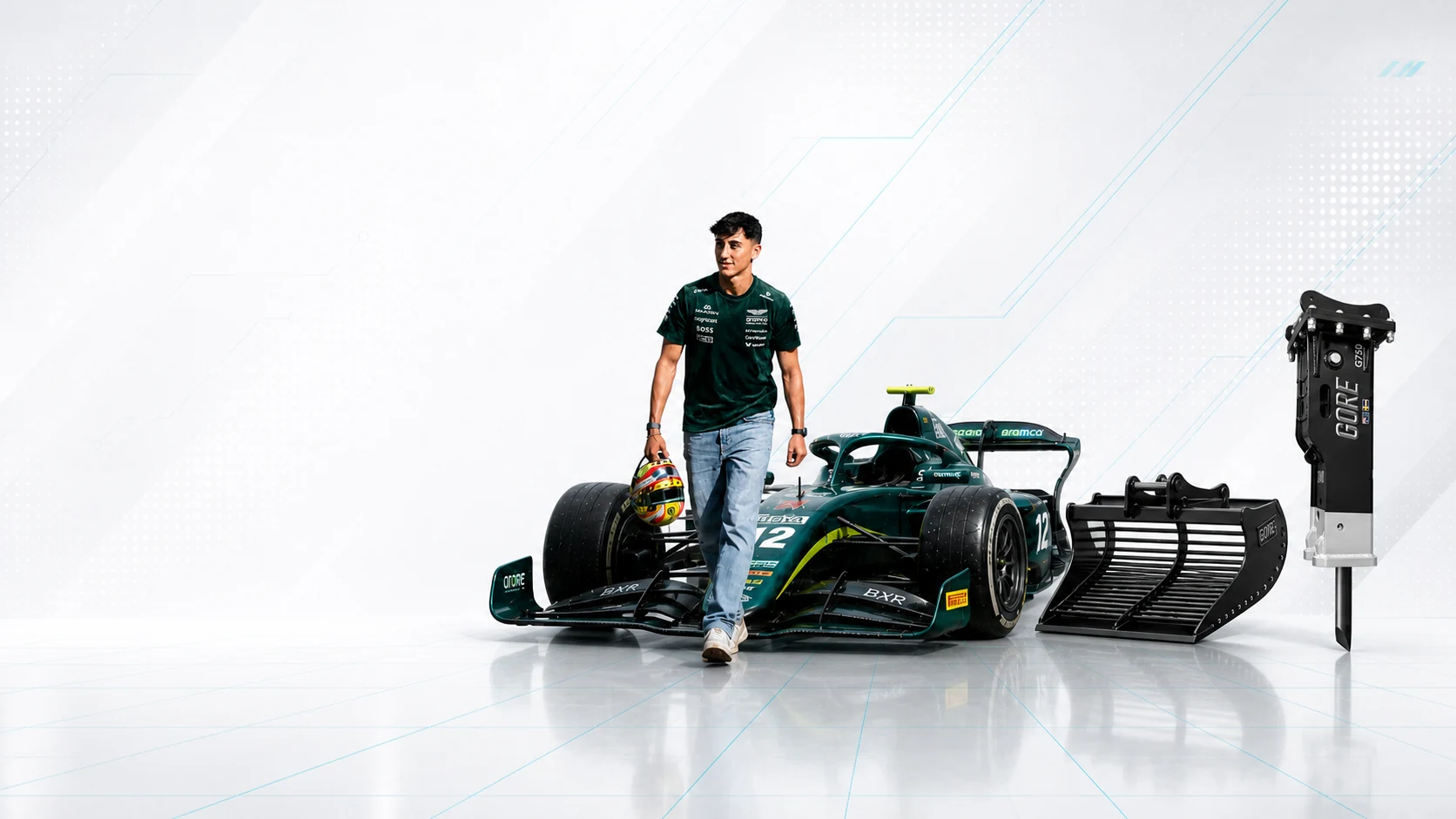 Mari Boya beside his number 12 Formula 2 car, a GORE bucket and a GORE hydraulic hammer